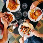 four plates with food