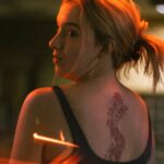 a woman with a dragon tattoo
