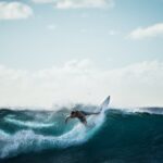 surfing a wave at Bali beachfront resort